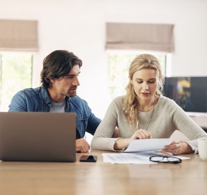 Couple discussing financial tax documents